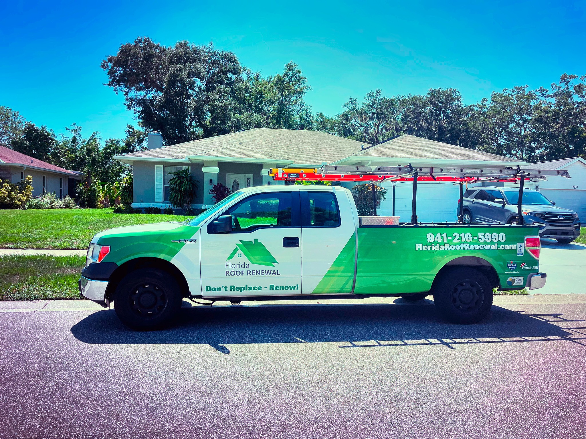 Florida Roof Renewal soft washing crew at residential property